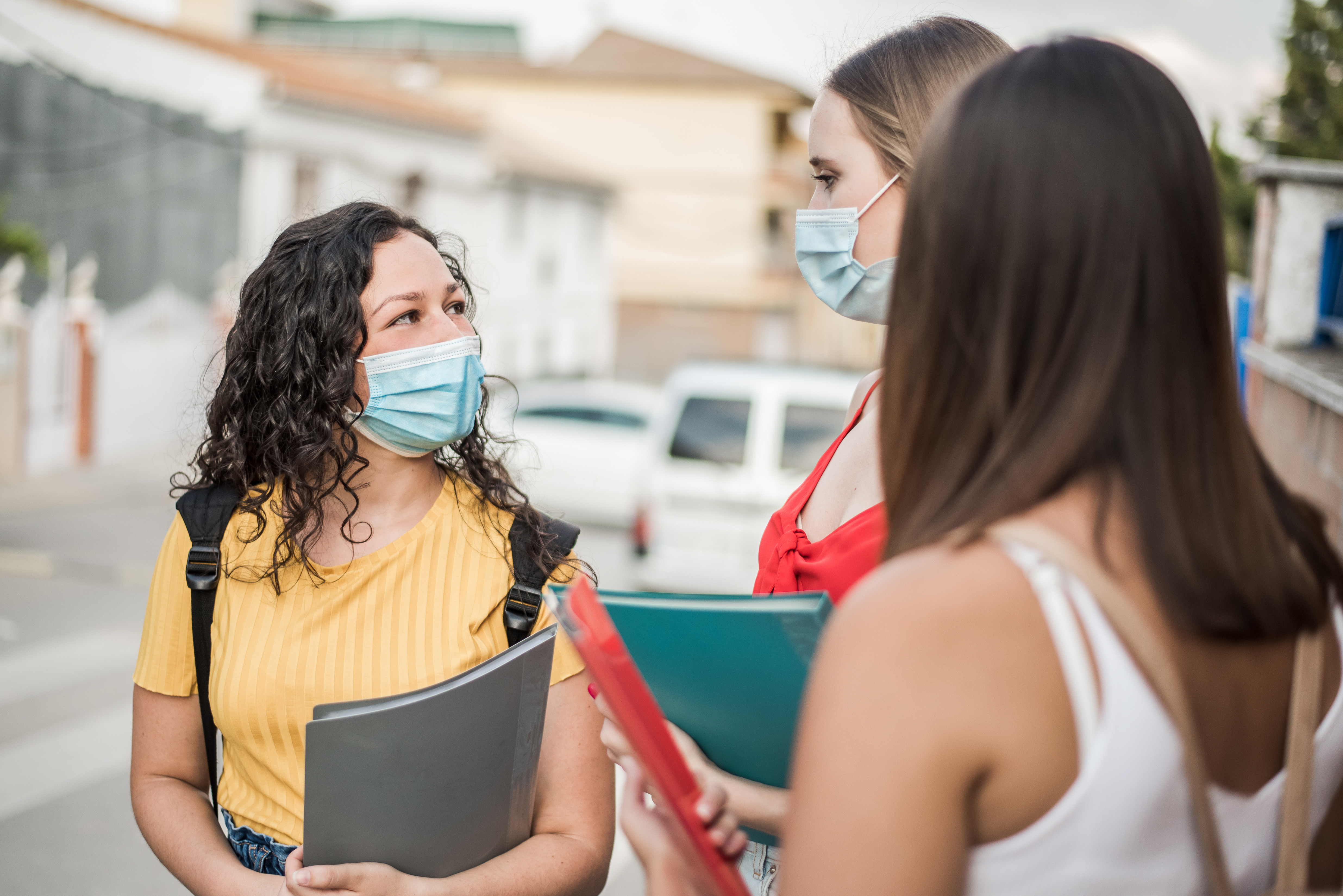 Students talking on campus during COVID-19 pandemic