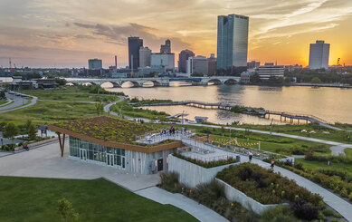 Photo of Toledo Glass City Metropark with sun setting over river