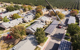 Insulated metal panel roofing being installed as part of a zero net carbon retrofit at Vera Cruz Village