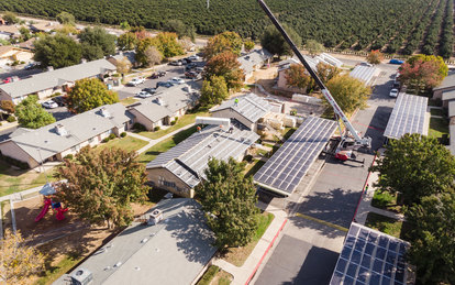 Insulated metal panel roofing being installed as part of a zero net carbon retrofit at Vera Cruz Village