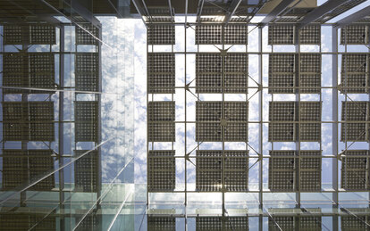 Photo looking up at an innovative solar panel shade structure at UC Merced