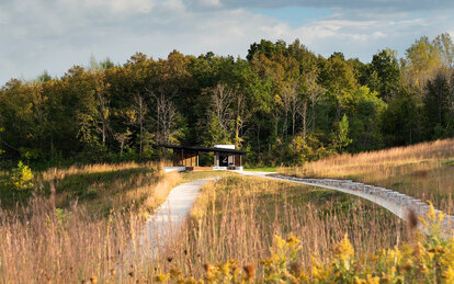Photo of trail leading to a picnic shelter along the restored bluff